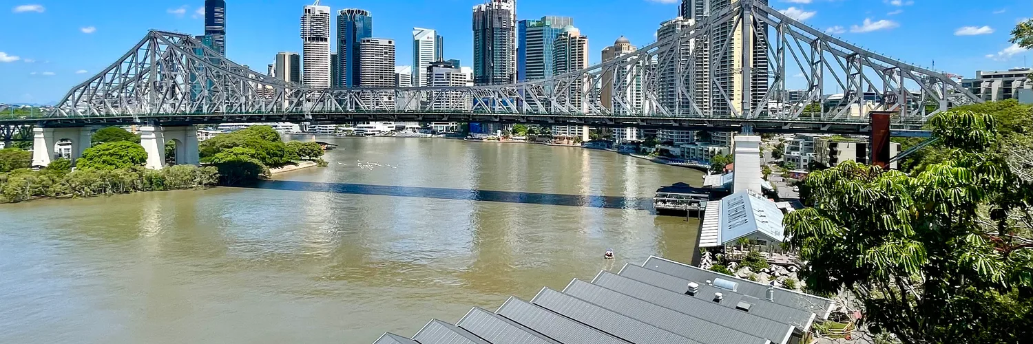 The Story Bridge and Brisbane city skyline from the river