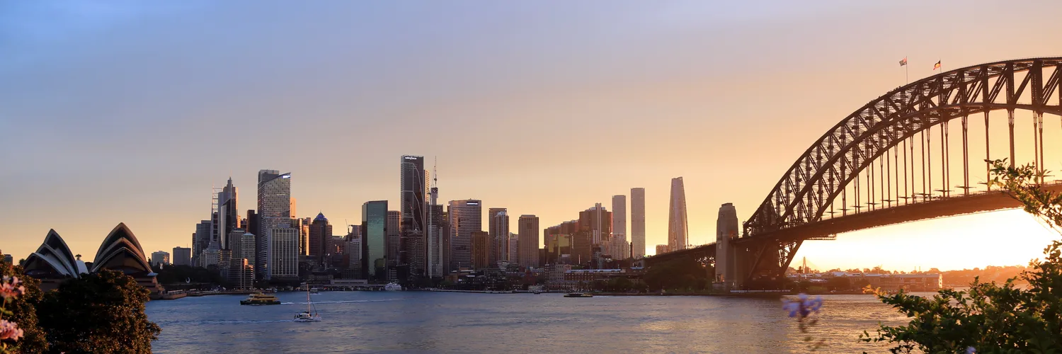 Sydney Harbour and the city skyline at golden hour