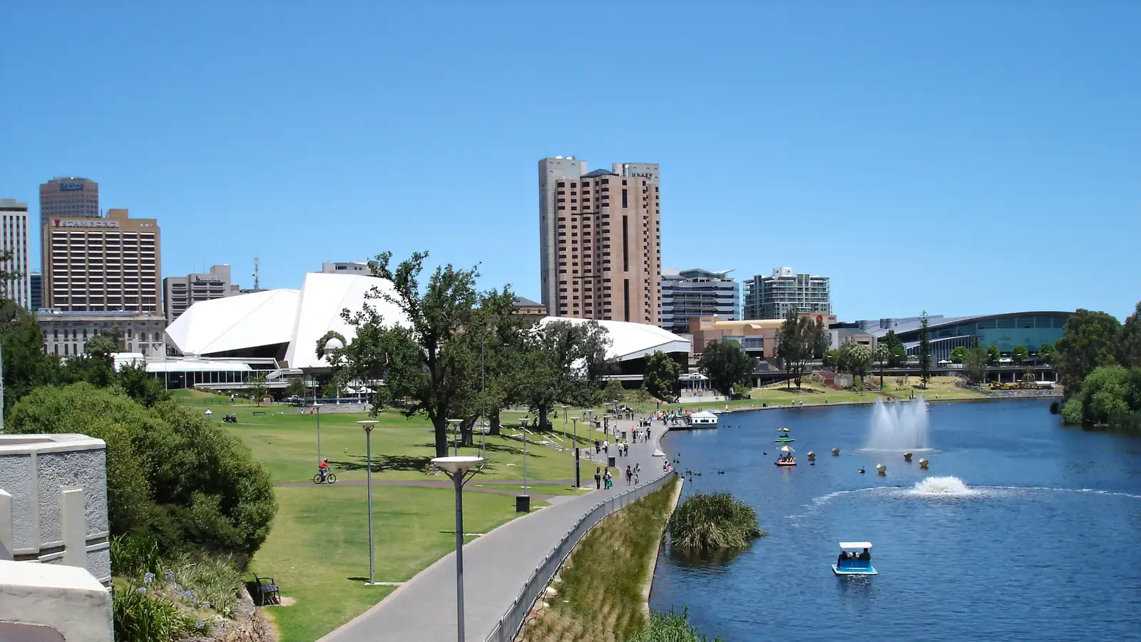 River Torrens and riverside path with Adelaide city buildings behind on a sunny day