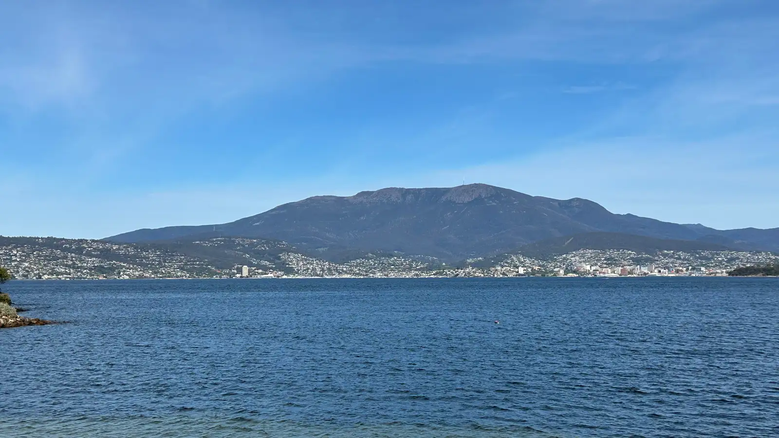 Hobart city across the River Derwent with kunanyi/Mount Wellington behind