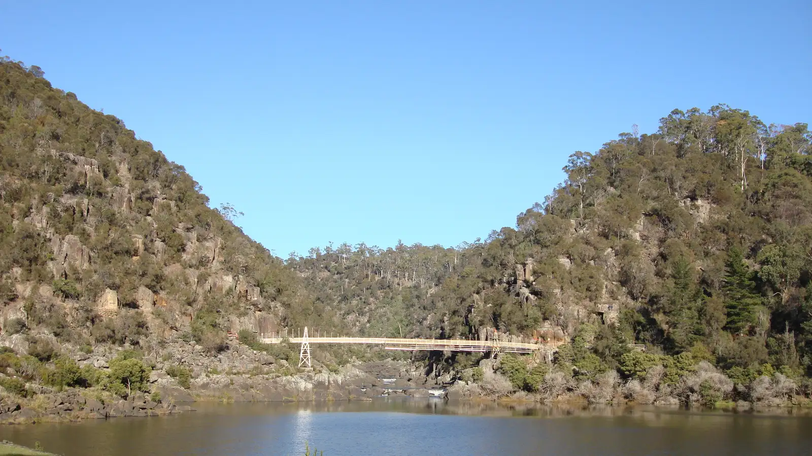 Cataract Gorge First Basin in Launceston with the suspension bridge and bush-covered hills
