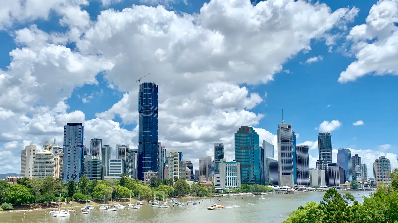 Brisbane city skyline across the Brisbane River from Kangaroo Point on a bright day